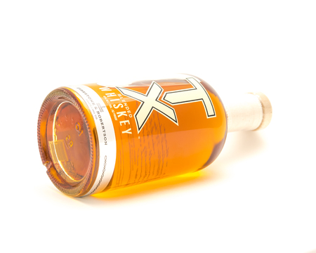 Lying bottle of TX Blended Whiskey isolated on white from Firestのeditorial素材