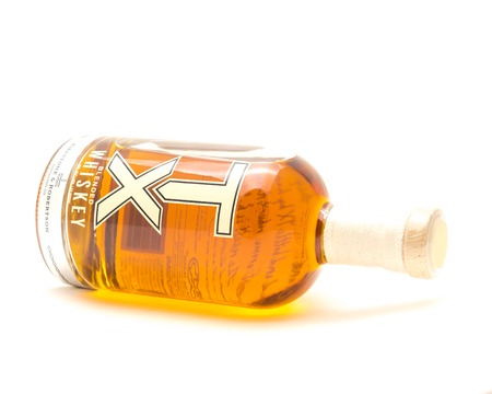 Lying bottle of TX Blended Whiskey isolated on white from Firestのeditorial素材