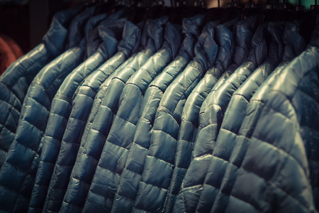 Filtered tone row of women down jackets at American outdoor clotの写真素材