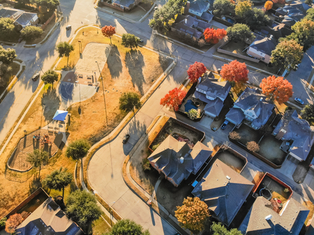 Top view residential playground with colorful fall leaves near Dの写真素材