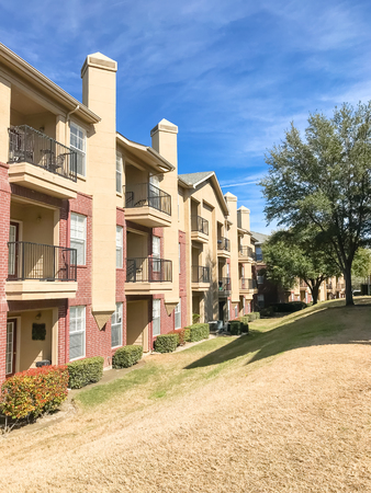 Apartment building with chimney and steep backyard in Texas, Americaの写真素材