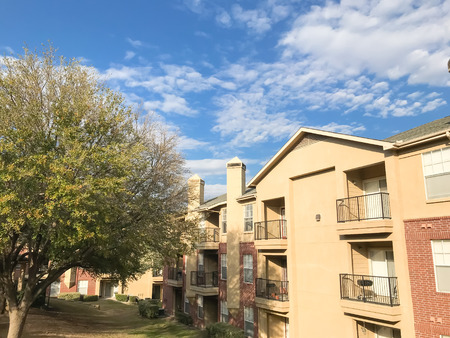 Typical apartment complex with steep grassy backyard in North Texas, Americaの写真素材