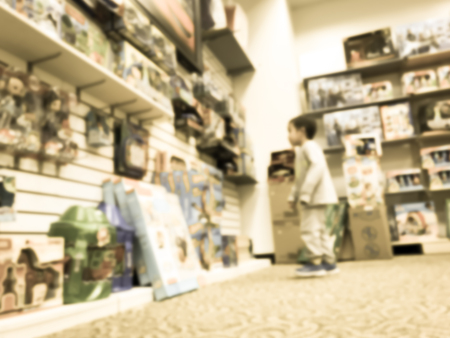 Filtered tone toys store in USA with customer shoppingの写真素材