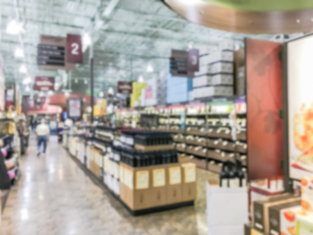 Abstract blurred customer shopping for variety of wines at American alcohol retailerの写真素材