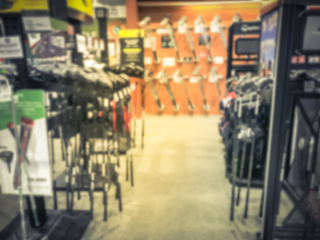 Blurry background variety of golf gears at sport department store in USAの写真素材