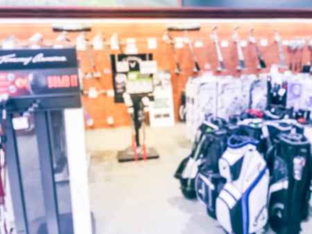 Blurry background variety of golf gears at sport department store in USAの写真素材