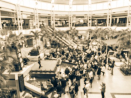 Vintage tone blurred abstract public music show at shopping mall in Texas, America. Crowed audience watching free performance under the glass dormの写真素材