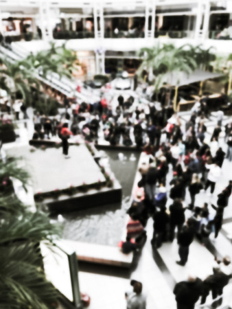 Vintage tone blurred abstract public music show at shopping mall in Texas, America. Crowed audience watching free performance under the glass dormの写真素材