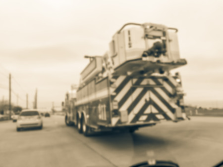 Motion blurred car accident on service road with fire truck and traffic