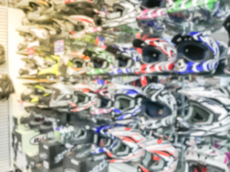 Blurry background variety of motorcycle helmet at retail store in USAの写真素材