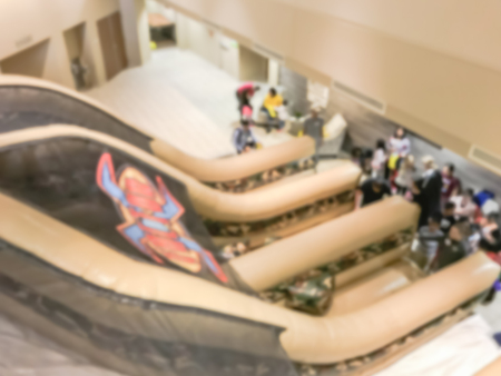 Blurred motion top view huge indoor inflatable slide at game day in American church