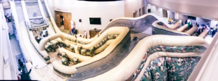 Panorama view blurred abstract top view huge indoor inflatable slide at game day in American churchの写真素材