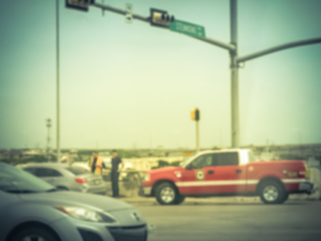 Blurry background accident at road intersection with fire truckの写真素材