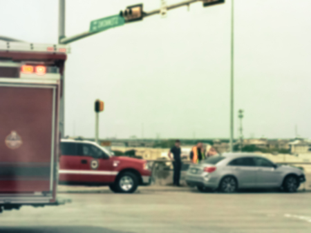 Blurry background accident at road intersection with fire truckの写真素材