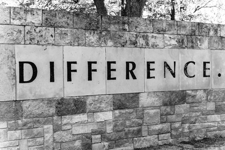 Old stone texture of Difference with a dot word on wall brick