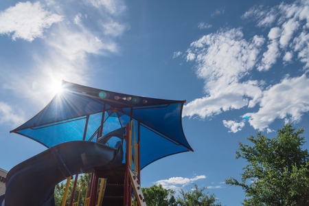 Low view of neighborhood playground with colorful structure equipment near Dallas, Texasの写真素材