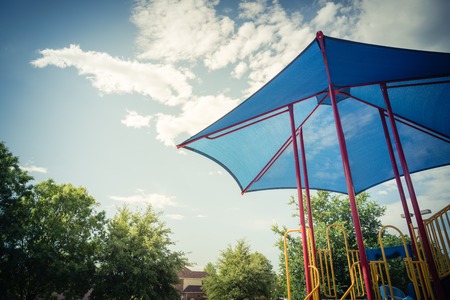 Filtered image a neighborhood playground with colorful structure equipment near Dallas, Texasの写真素材
