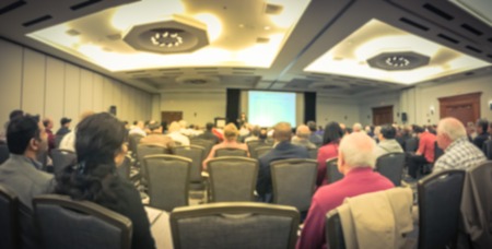 Panoramic view blurry background business workshop with lady speaker in Texas, USA