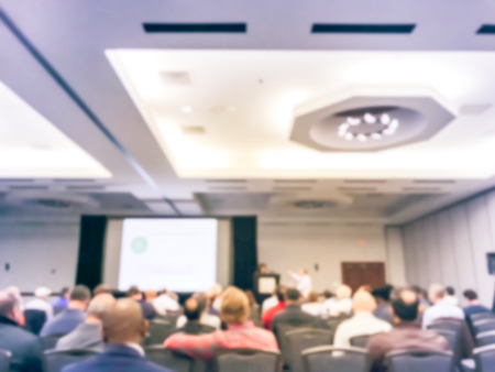 Blurry background business workshop with lady speaking with projector in Texas, USAの写真素材