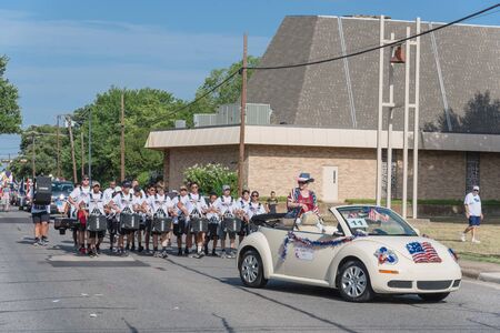 Old car and high school drummers at Independence Day celebrationのeditorial素材
