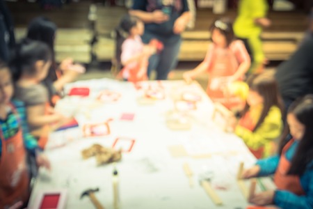 Blurry background kids craft workshop at hardware store in America