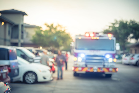 Filtered image blurry background fire disaster event at apartment complex in America
