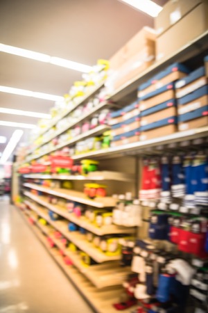 Blurry background aisle at sport store with variety of soccer, volleyballs and basketballsの写真素材