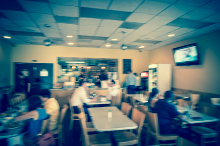 Blurry background people order takeout food at counter in compact Thai restaurant cafeの写真素材