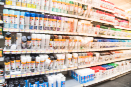 Blurry background variety of paint supplies at American grocery storeの写真素材