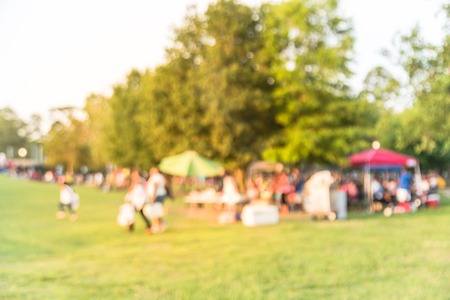 Blurry background resident enjoy BBQ and camping at local park in Houston, Americaの写真素材