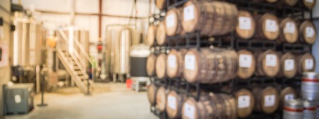 Panorama view blurry background metal tanks in microbrewery in Texas, USAの写真素材