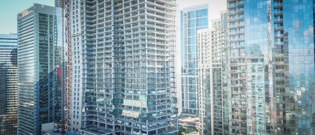 Panorama drone close-up view of Chicago skyline offices and commercial buildings along riversideの写真素材