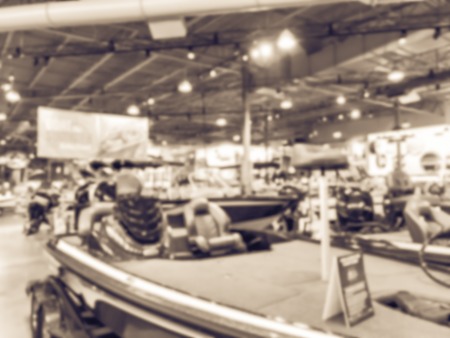 Vintage tone blurred abstract variety of boat and ATV vehicles at showroom large outdoor store in Texas, America. Boat buying and servicing conceptの写真素材
