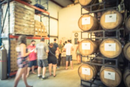 Blurry background customer queue to taste draft beer from American brewing taproom