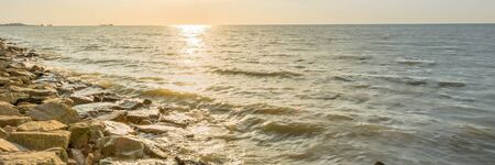 Panoramic view long break wall shoreline and sunset at horizontal in Melaka