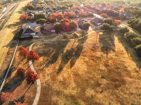 Colorful park side residential area with bright autumn leaves near Dallas, top viewの写真素材