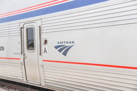 FORT WORTH, TX, US-MAY 10, 2019: Close-up logo of Amtrak near train door entrance. The National...