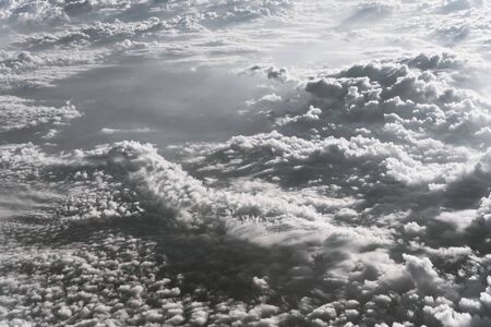 Vintage tone beautiful and unusual Altocumulus or Cirrocumulus cloud formation seen from airplane...