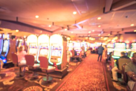Blurry background players enjoy gambling at American casinoの写真素材