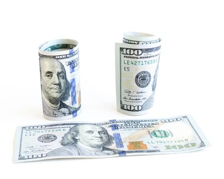 One hundred (100) dollars banknote isolated on white background. Roll and flat largest denominations...