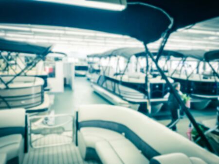 Toned image abstract blurred inside a large boat dealer selling variety of new and used boats near Dallas, Texas, USA. recreational boating buying, trade-in and servicing conceptの写真素材