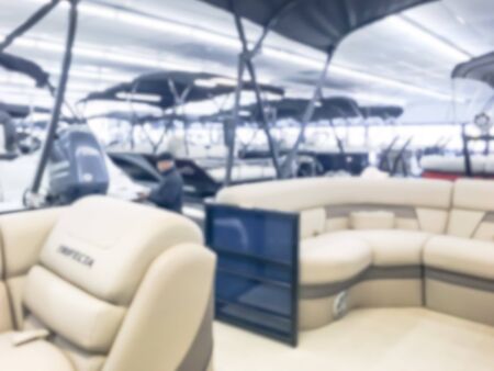 Motion blurred inside a large boat dealer selling variety of new and used boats near Dallas, Texas, USA. recreational boating buying, trade-in and servicing conceptの写真素材