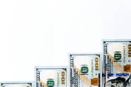 Top view money staircase made from 100 United States Dollar (USD) banknotes, bills isolated on white background. Business growth upward conceptual backgroundの写真素材
