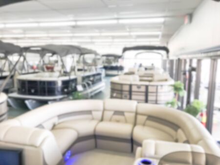 Motion blurred inside a large boat dealer selling variety of new and used boats near Dallas, Texas,...