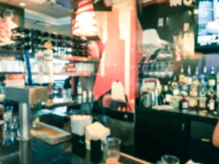 Blurred motion a bar counter of compact restaurant in Seattle, Washington, USA. Variety of beer tap...