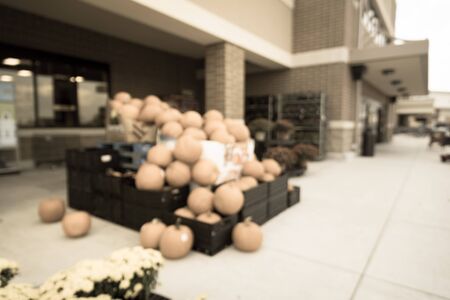 Vintage tone blurred customer shopping for Halloween supplies at grocery store in Houston, Texas....