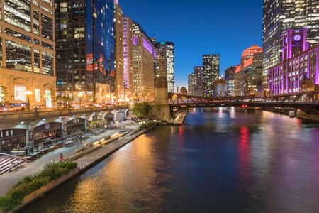 Stunning view of riverside Chicago skylines at blue hour toward Clark Streetの写真素材