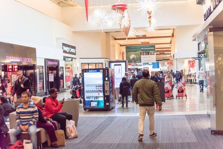 GRAPEVINE, TEXAS, US-NOV 29, 2019: Crowded of diverse people shoppers at Grapevine Mills mall during Black Friday weekend shopping event. Diverse-scale market place in Dallas-Fort Worth Metroplexのeditorial素材