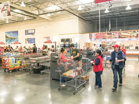 DALLAS, TX, US-OCT 19, 2019: Self-checkout kiosks area at Costco in Churchill Way, Dallas. Support staff uniform advertising App. This option available at 125 wholesale stores to reduce long linesのeditorial素材