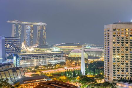 Aerial view public residential condominium building complex and downtown skylines at Bugis neighborhood in Singapore at blue hour.の写真素材